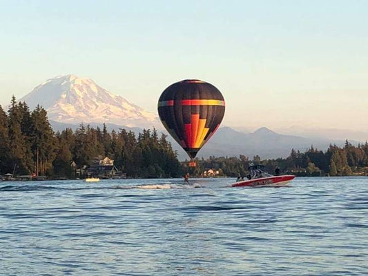 Wakesurf boat board balloon lake and mountain